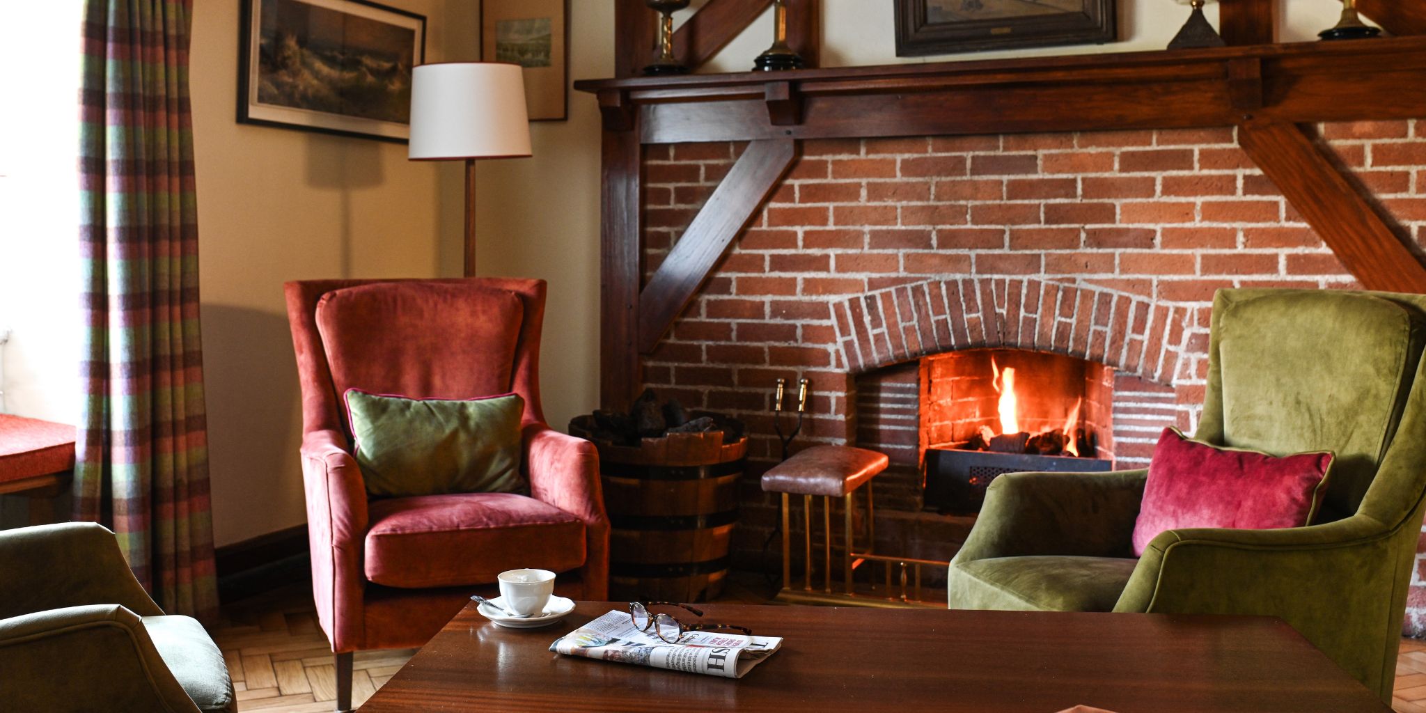 a room with a fireplace and a coffee table
